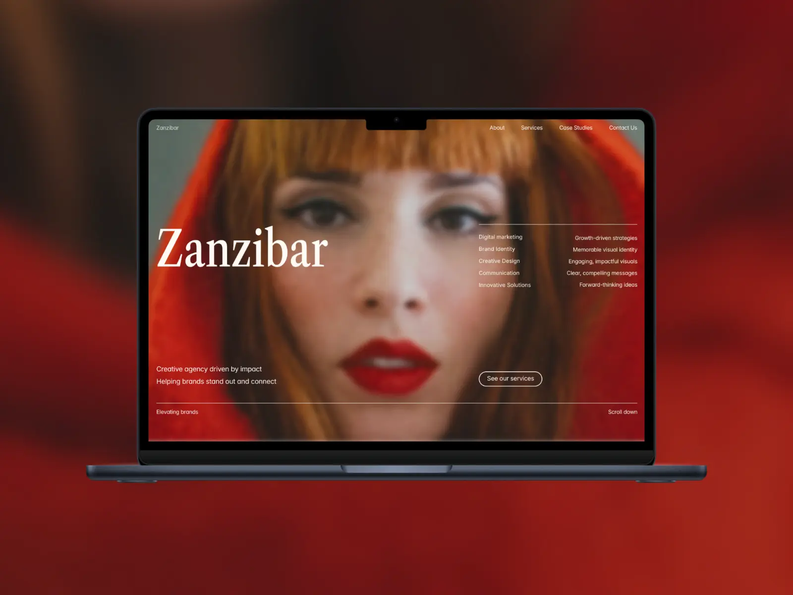 A laptop displays a website with a blurred image of a woman in a red hood. The text